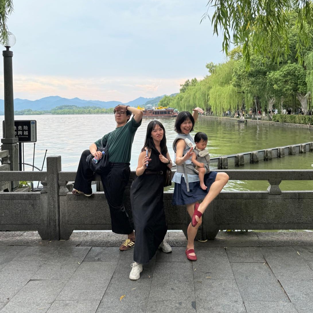 Lucas, Yiqing, and Ava at West Lake, Hangzhou — the wife-and-husband co-founders.